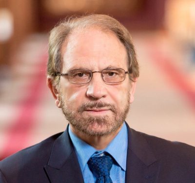 headshot of man in suit