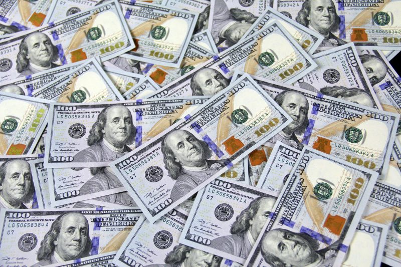 An arrangement of $100 bills displaying Benjamin Franklin's face. Photo courtesy Pexels