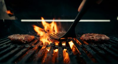 Burger patties on a grill. Image courtesy Pexels.